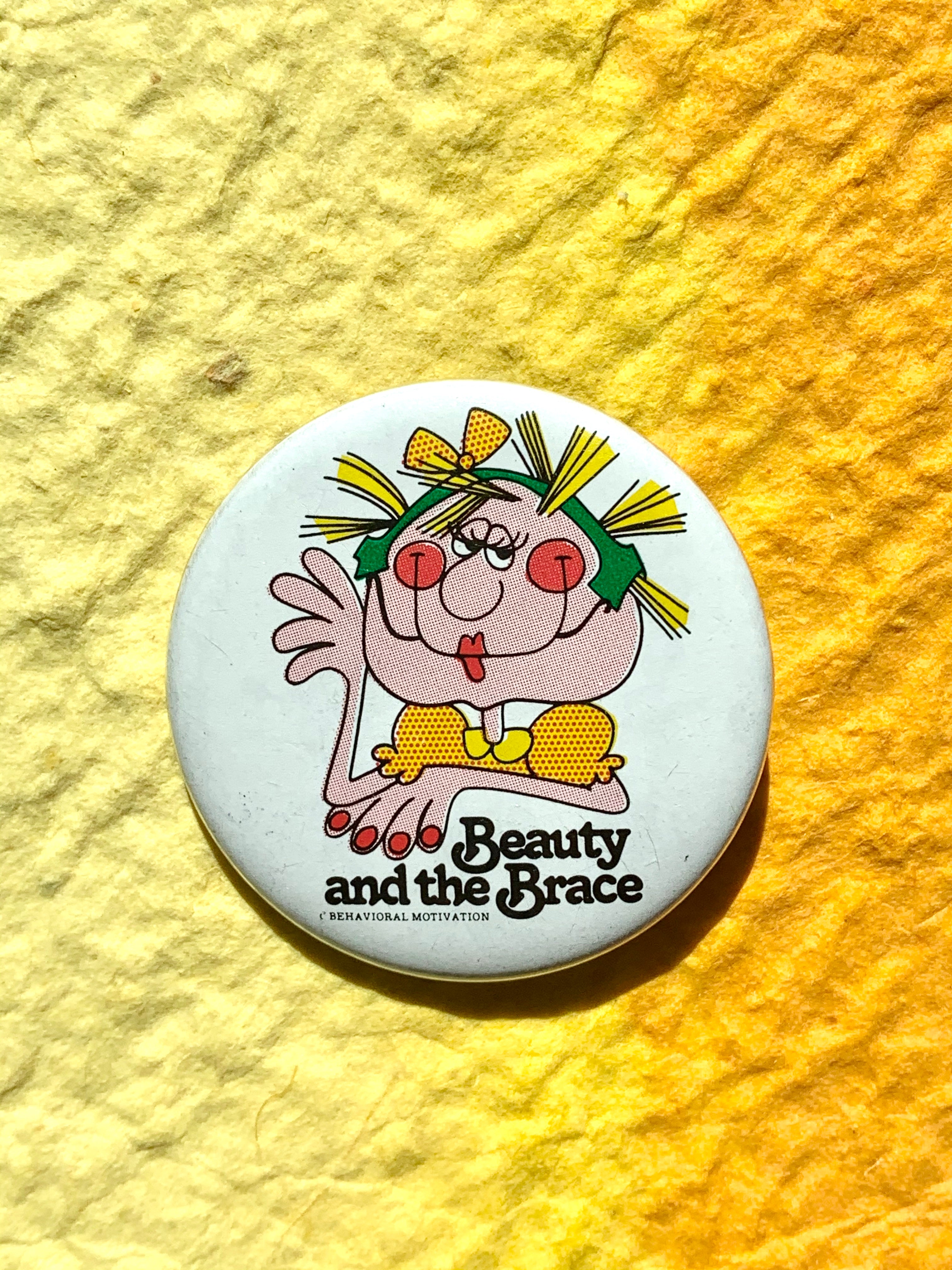 "Beauty and the Brace" Quirky Vintage Pinback Button