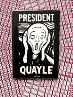 Vintage pinback button with 'President Quayle' text and a cartoon illustration of a surprised face.