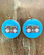 Load image into Gallery viewer, Earrings with a design of a boombox on a blue background, displayed against a textured surface.
