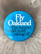 Vintage Pinback Button "Fly Oakland The Airport That's Really Taking Off"