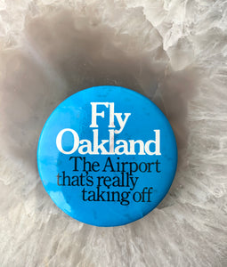 Vintage Pinback Button "Fly Oakland The Airport That's Really Taking Off"