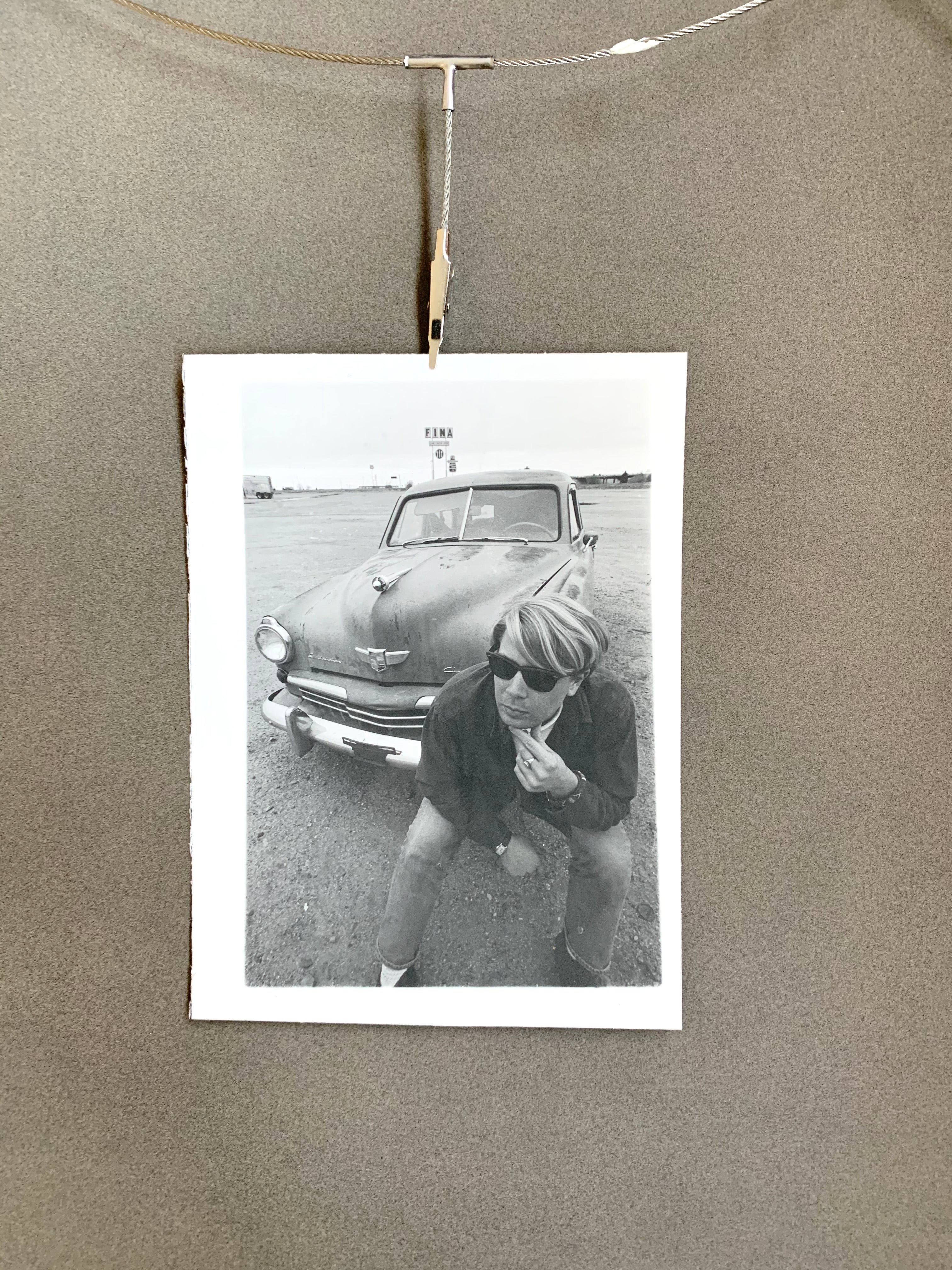 Black and White Photograph of Man w/ Vintage Classic Car; Fina Station Sign
