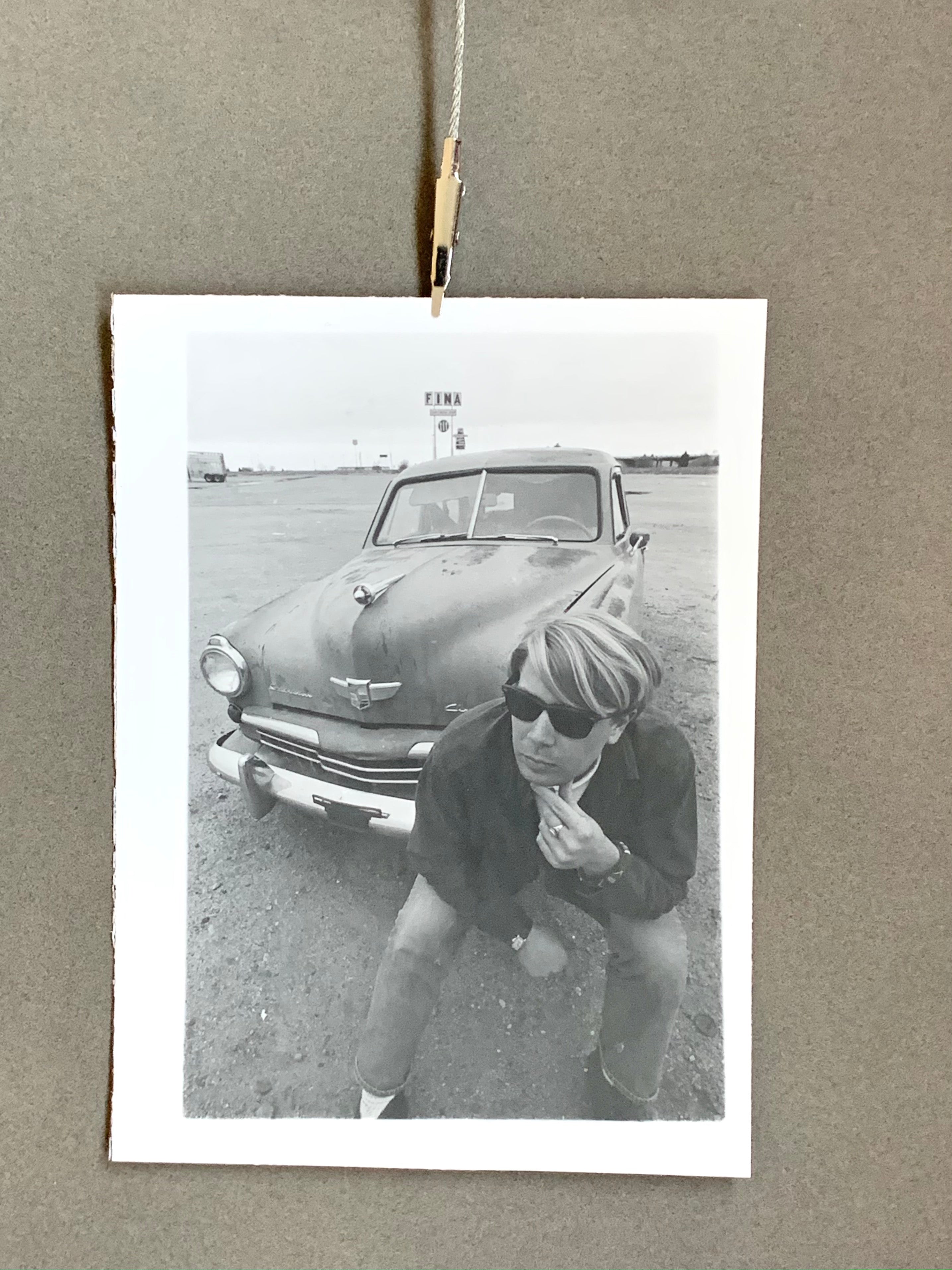 Black and White Photograph of Man w/ Vintage Classic Car; Fina Station Sign