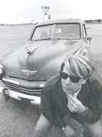 Black and White Photograph of Man w/ Vintage Classic Car; Fina Station Sign