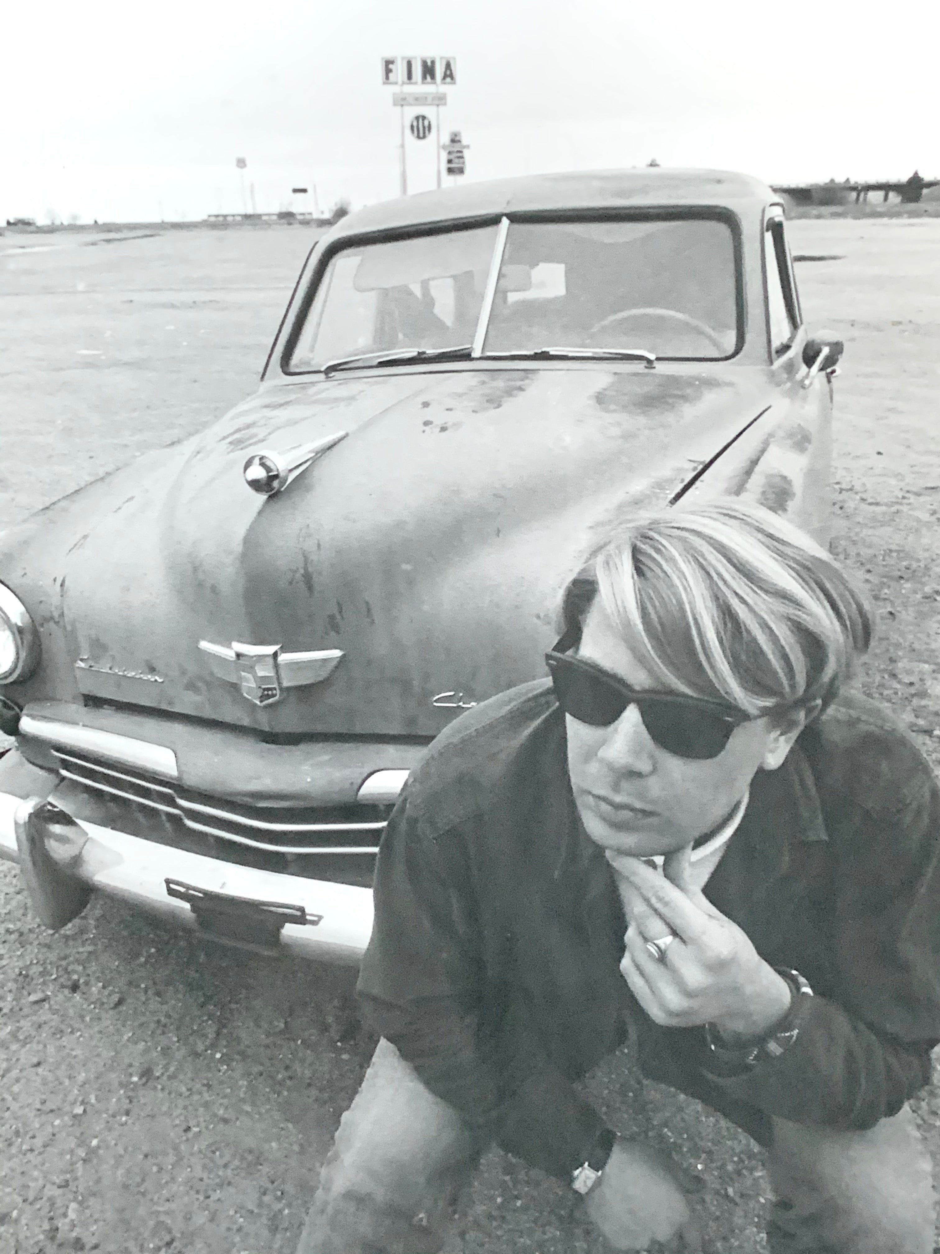 Black and White Photograph of Man w/ Vintage Classic Car; Fina Station Sign