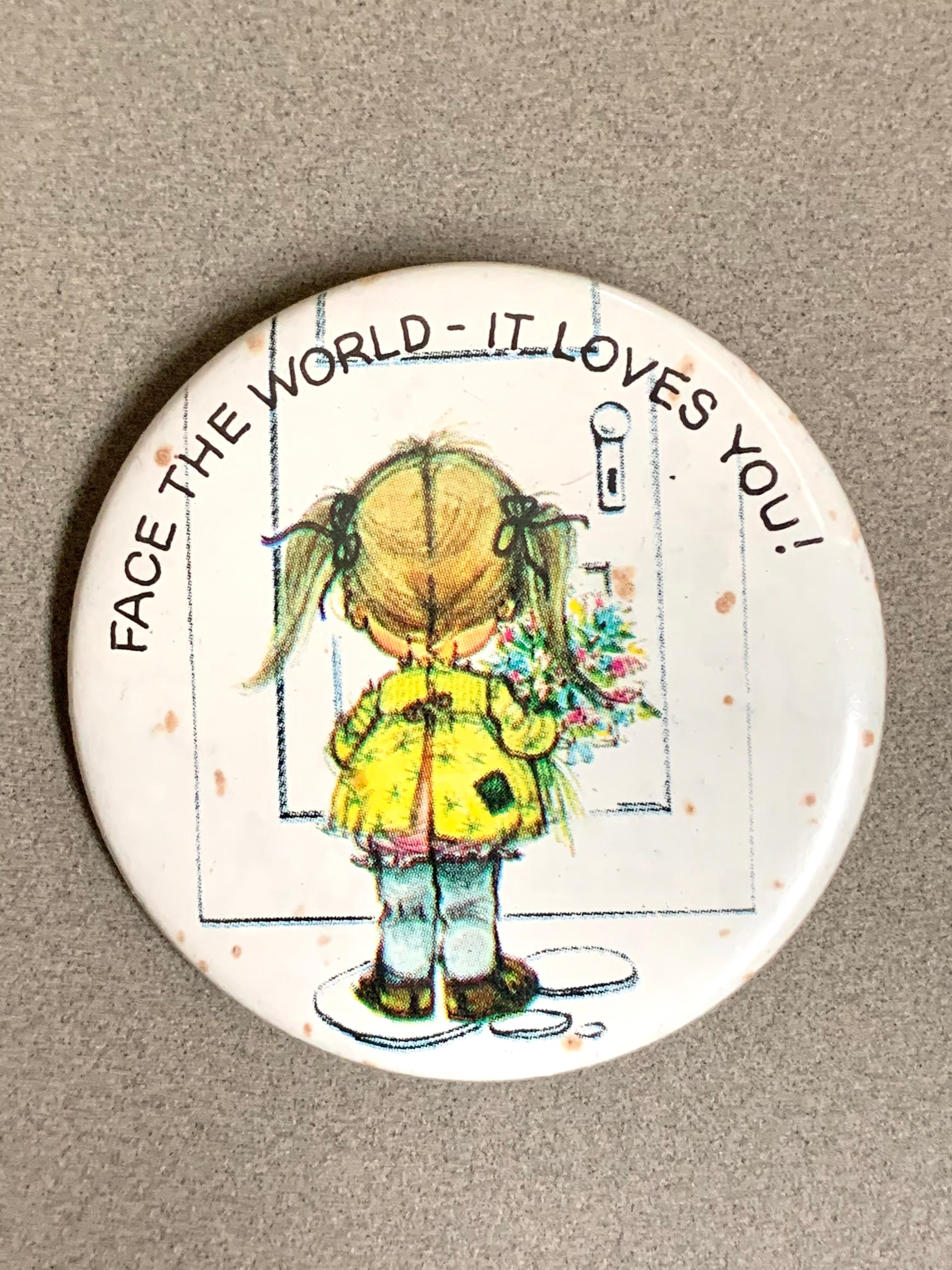 Face The World - It Loves You! Vintage Norcross Inc. Pinback Button Girl w/ Flowers